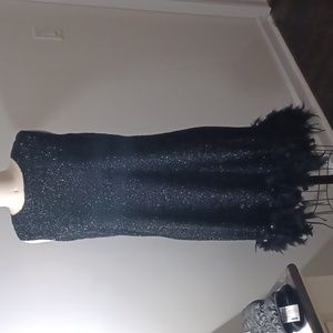 Womens sz medium dress. Stunning with real feathers on bottom of dress.